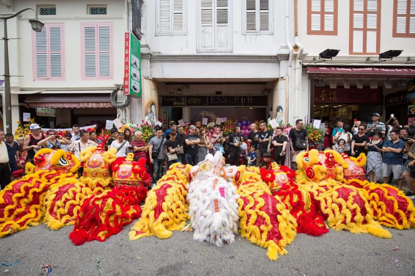 Our lion dance troupe performing with a full lion lineup in Chinatown, Singapore
