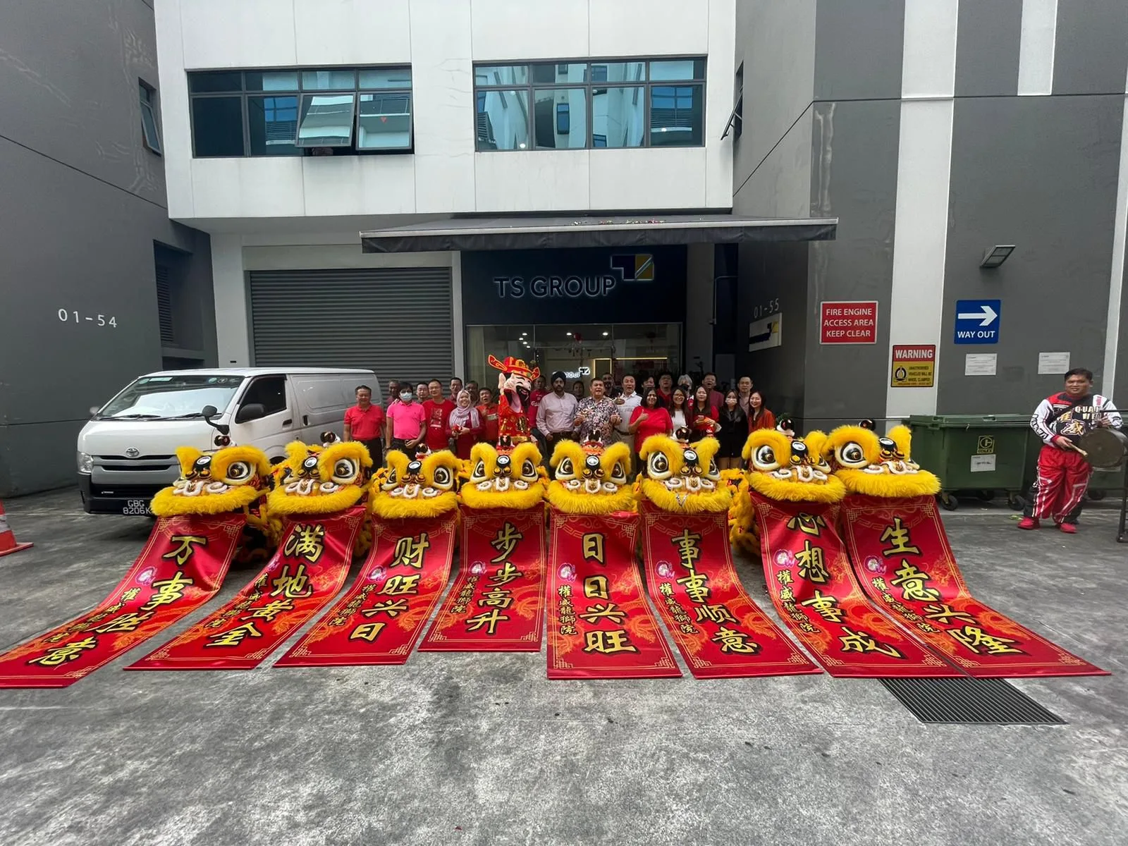 Opening ceremony lion dance blessing a new shopfront in Singapore